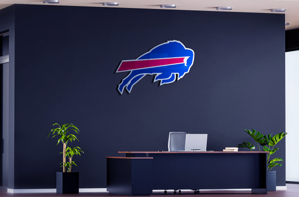 The Buffalo Bills NFL office is a modern and sleek space with the team logo prominently displayed. The room is set up for video meetings and has plenty of space for the general manager and other team personnel to sit comfortably.