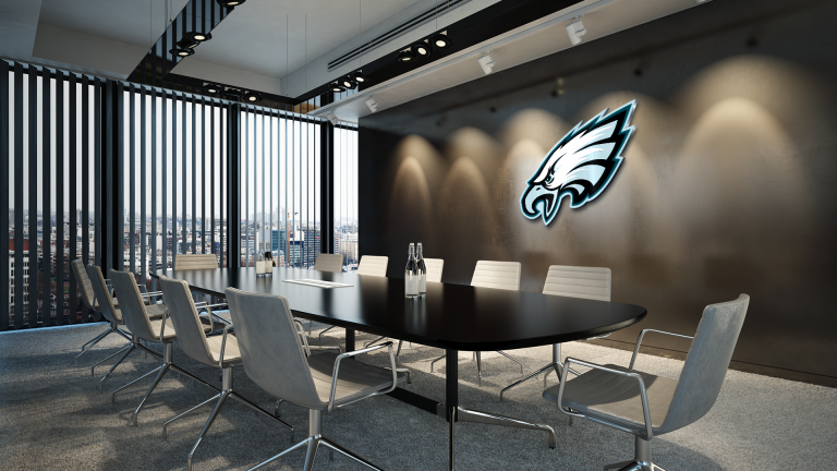 The Philadelphia Eagles NFL team has a meeting room for video conferences with the team logo and players.